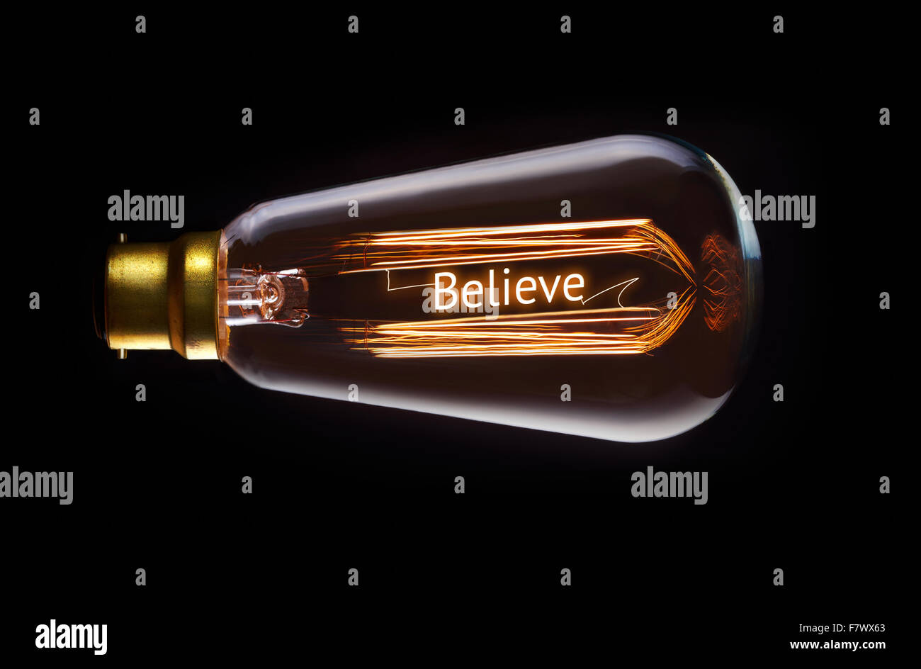 Religion, believe concept in a filament lightbulb. Stock Photo