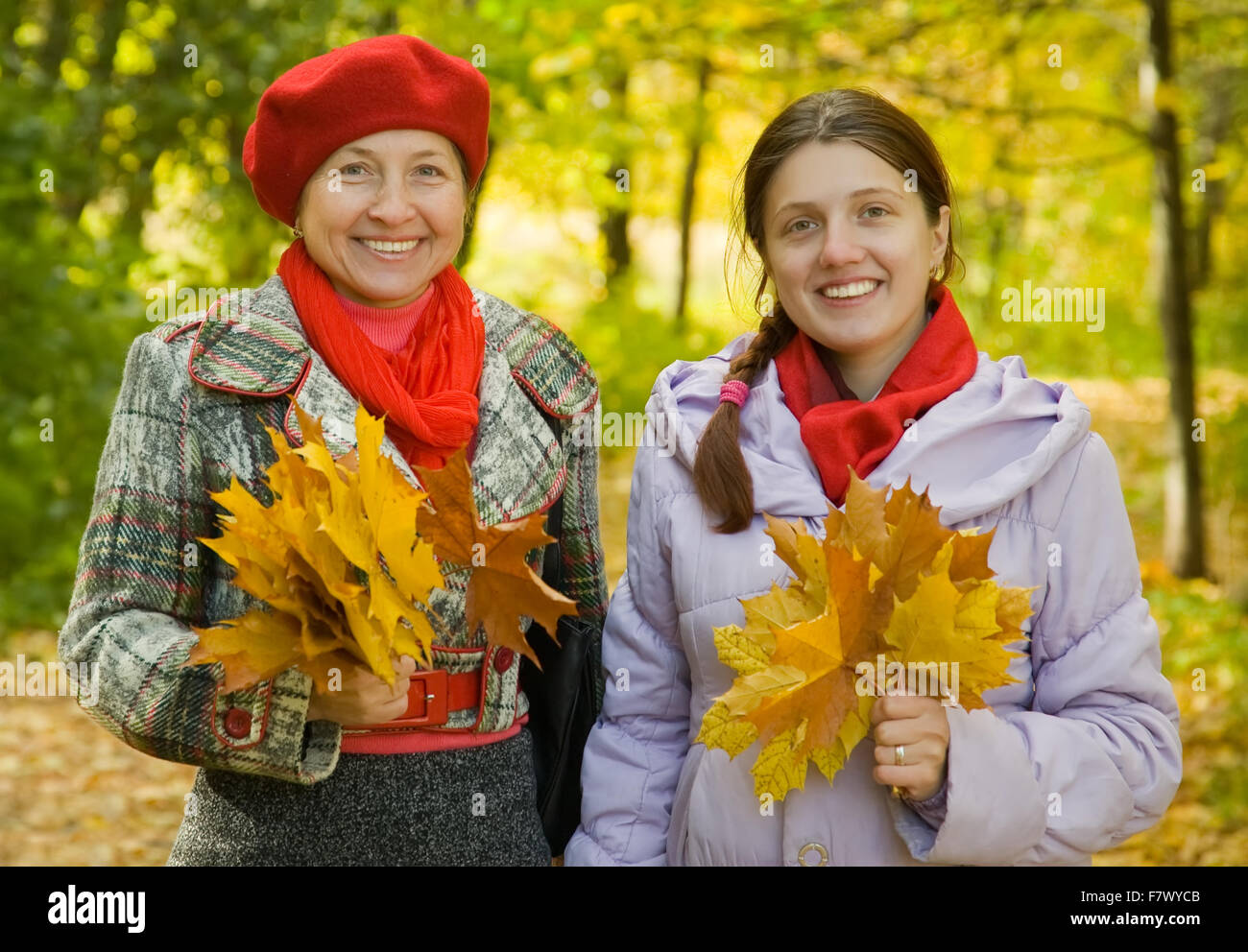 Happy mother with her adult daughter in autumn park Stock Photo - Alamy