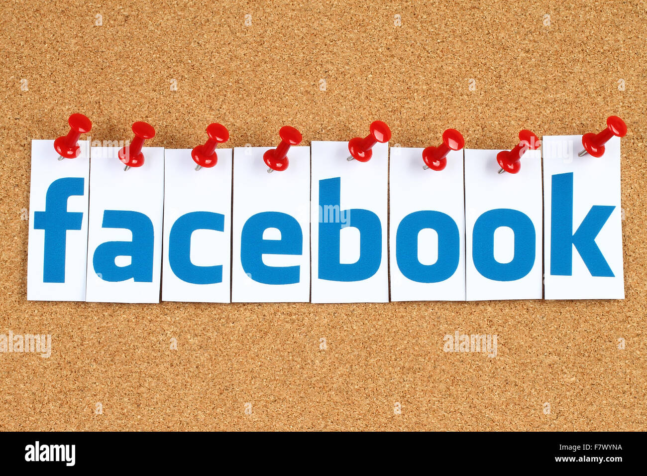Kiev, Ukraine - October 07, 2015: Facebook logo sign printed on paper, cut and pinned on cork bulletin board. Stock Photo