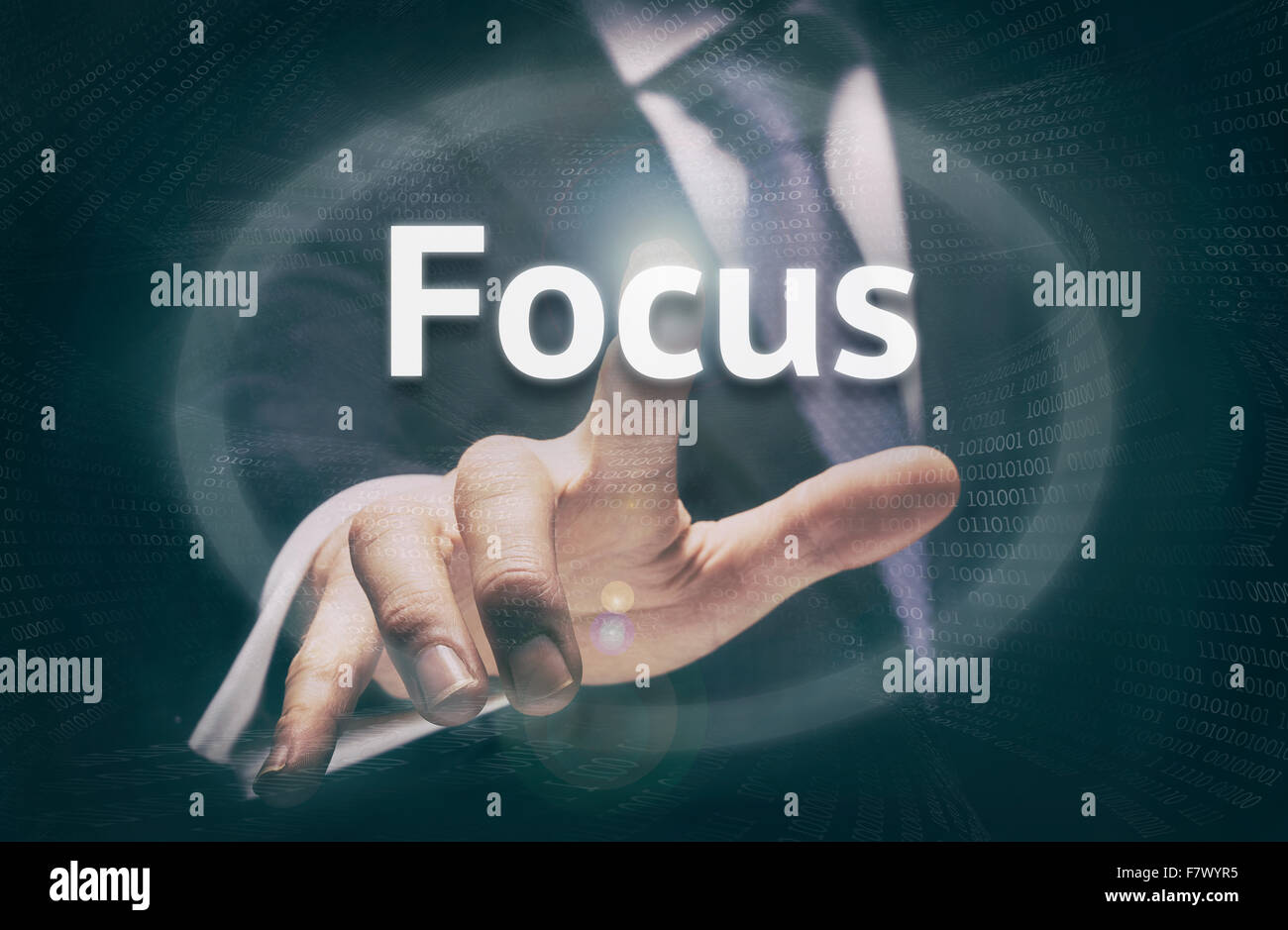 Businessman pressing an Focus concept button. Stock Photo