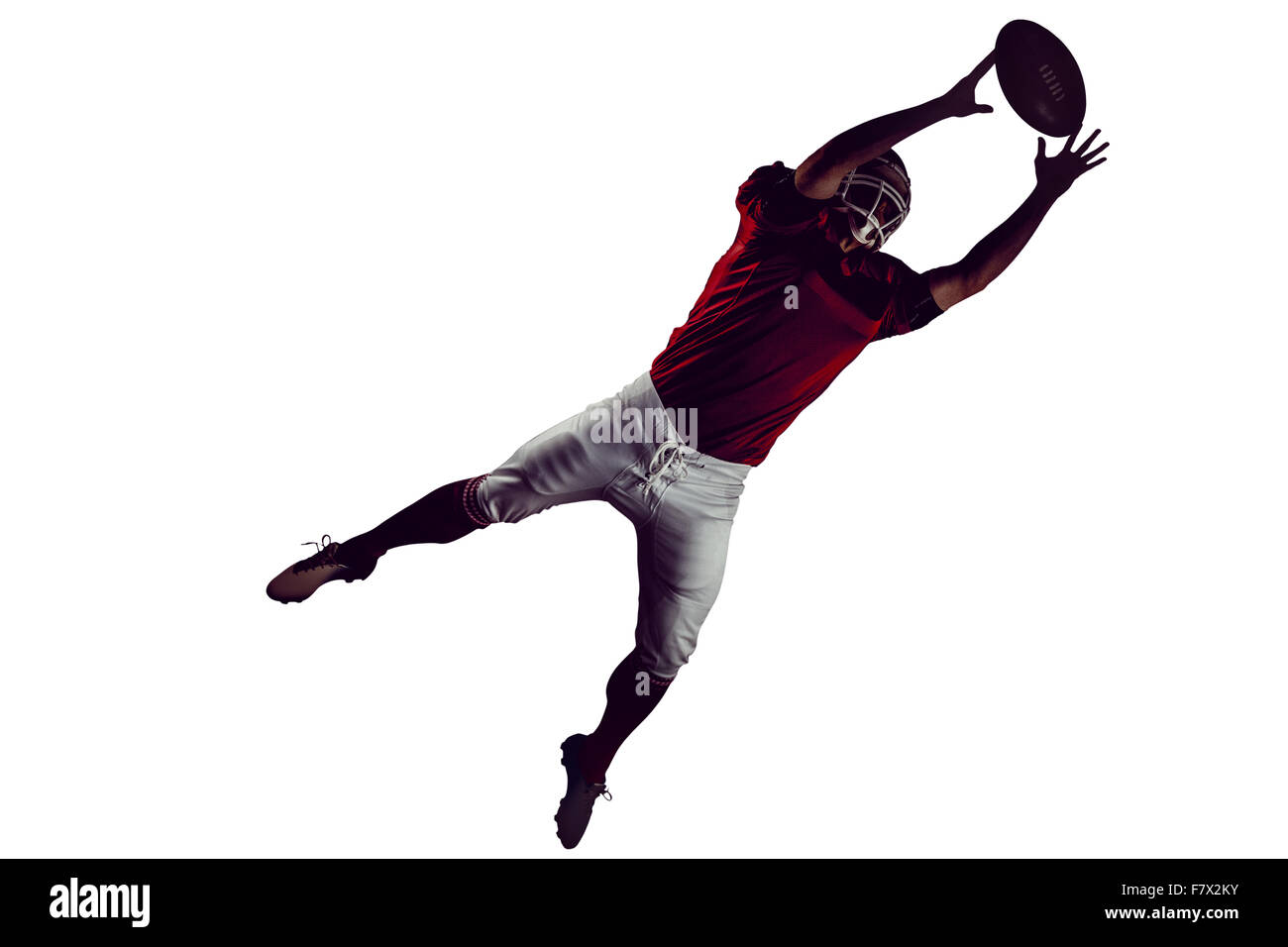 American football player trying to catch football Stock Photo Alamy
