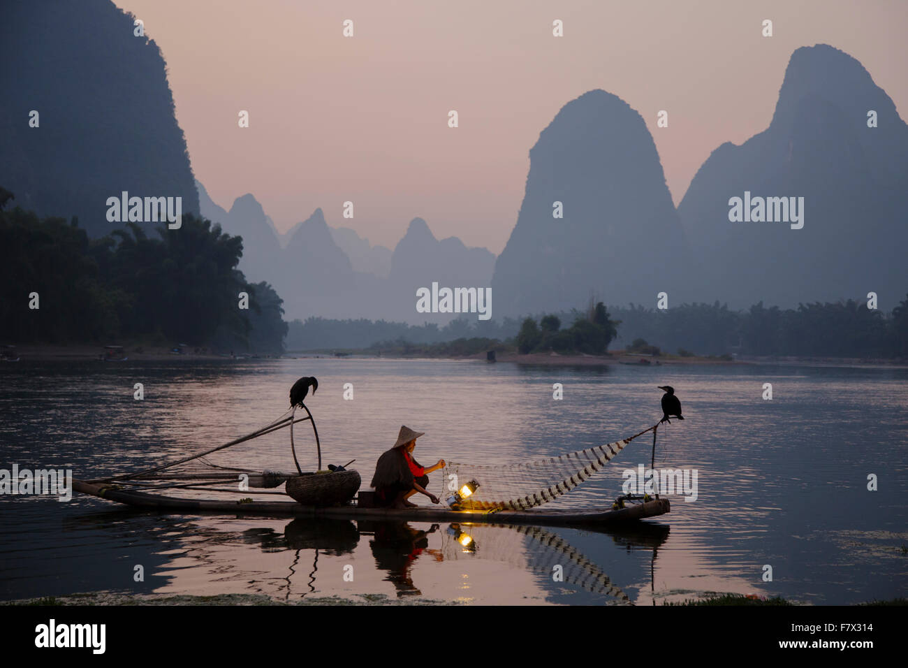 Cormorant Fisherman Lighting Lamp for Night Fishing Guilin Region Guangxi,  China LA008335 Stock Photo - Alamy