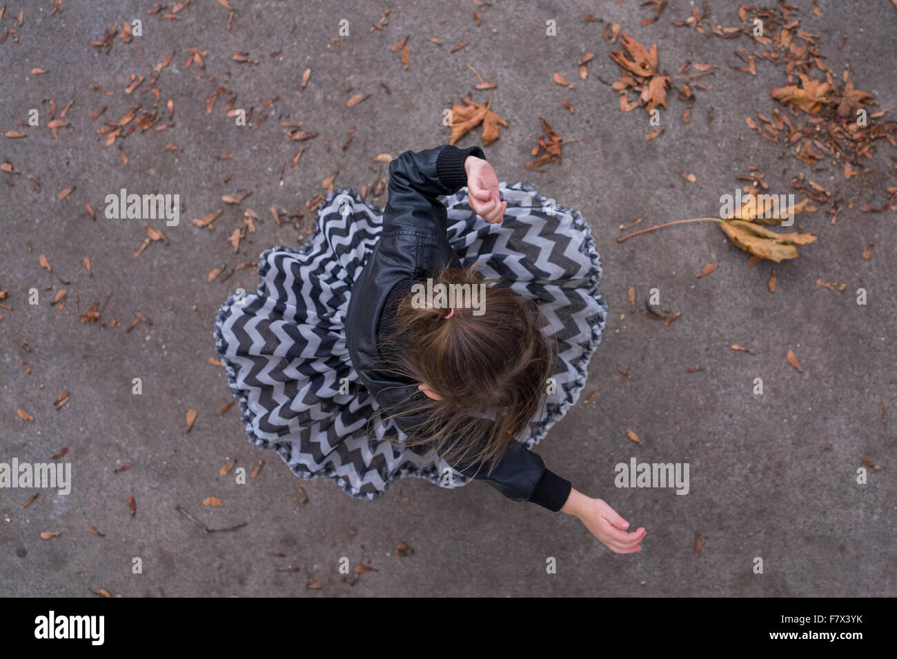 Overhead view of a Girl spinning around Stock Photo