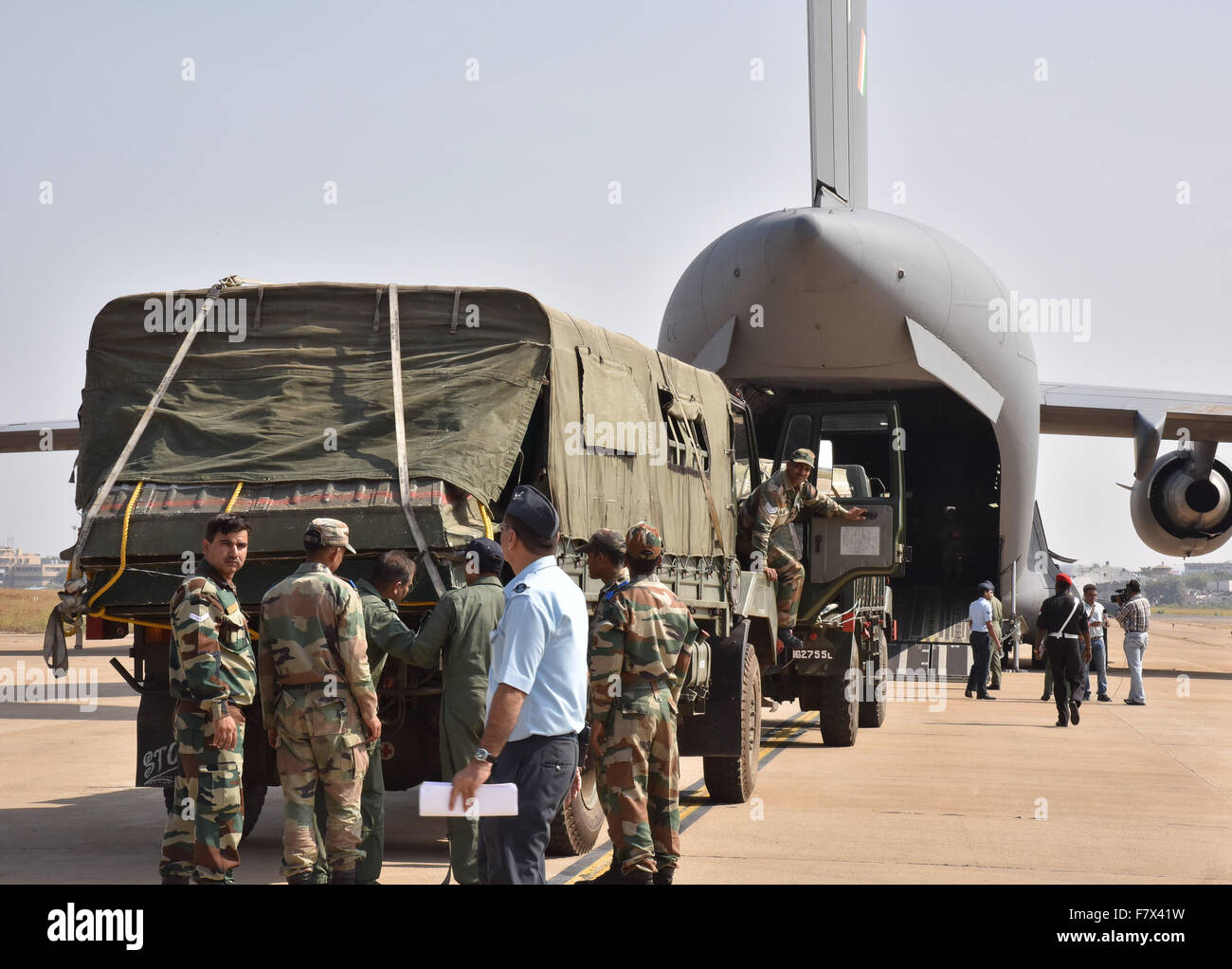 Hyderabad, India. 3rd Dec, 2015. Indian soldiers load a cargo plane ...