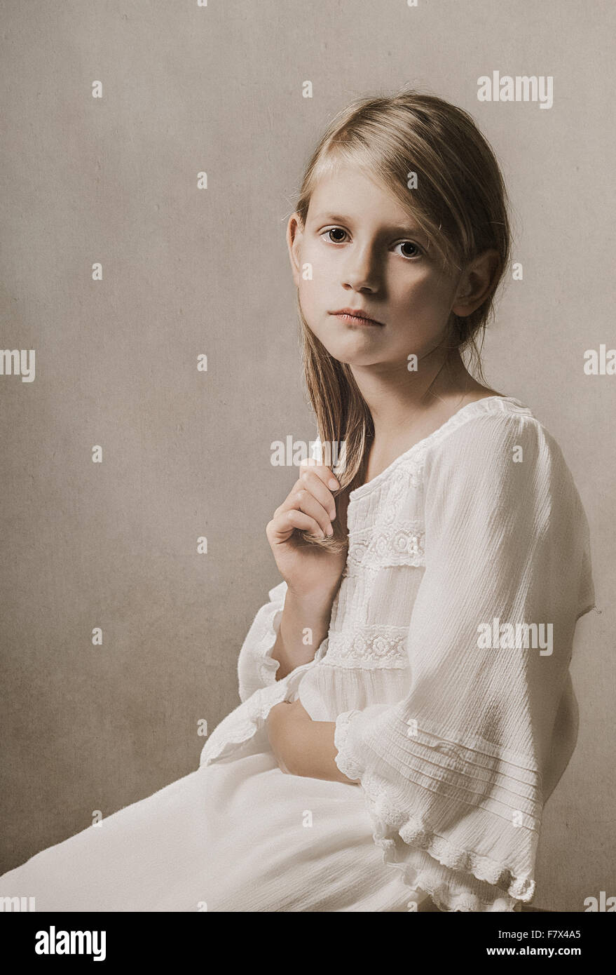 Girl sitting on plain hi-res stock photography and images - Alamy