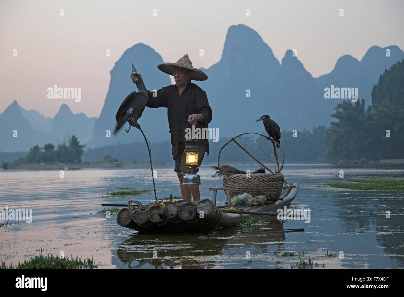 Cormorant Fisherman on River Li Guilin Region Guangxi, China LA008356 Stock Photo