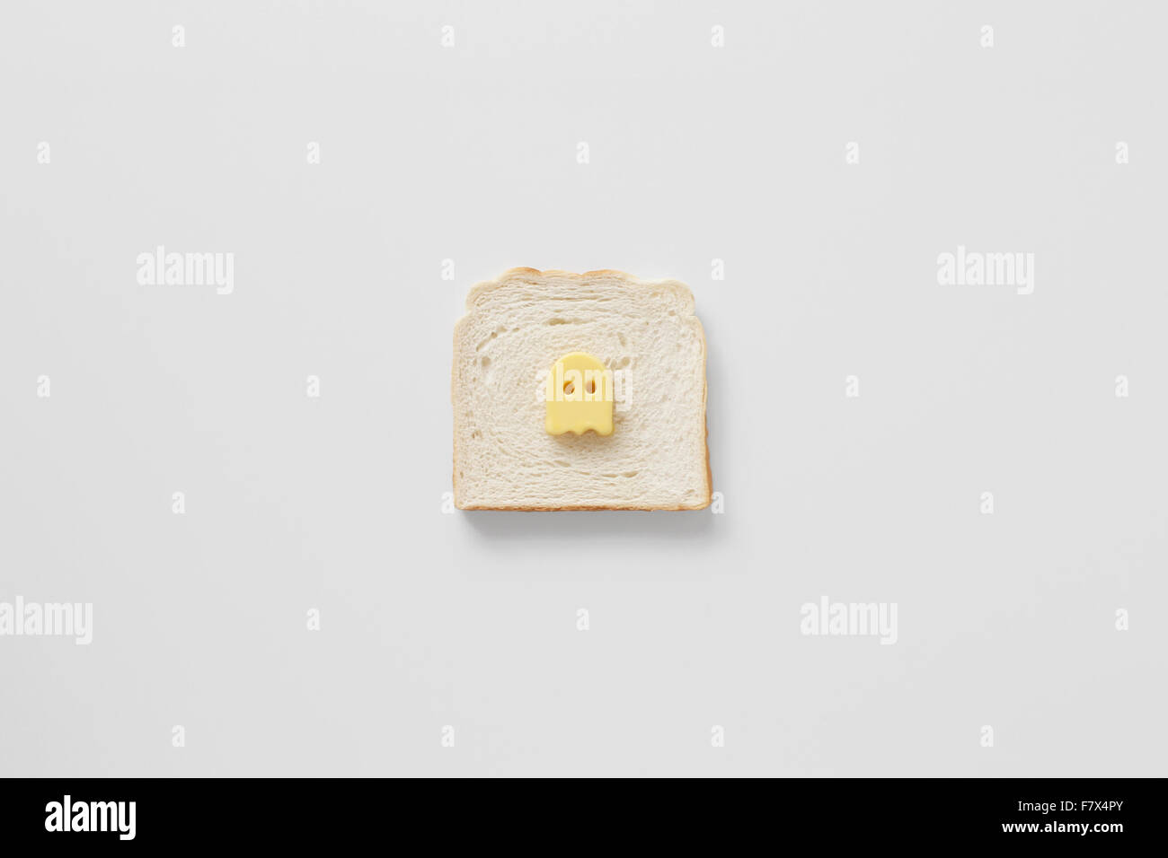 Conceptual butter ghost on bread Stock Photo