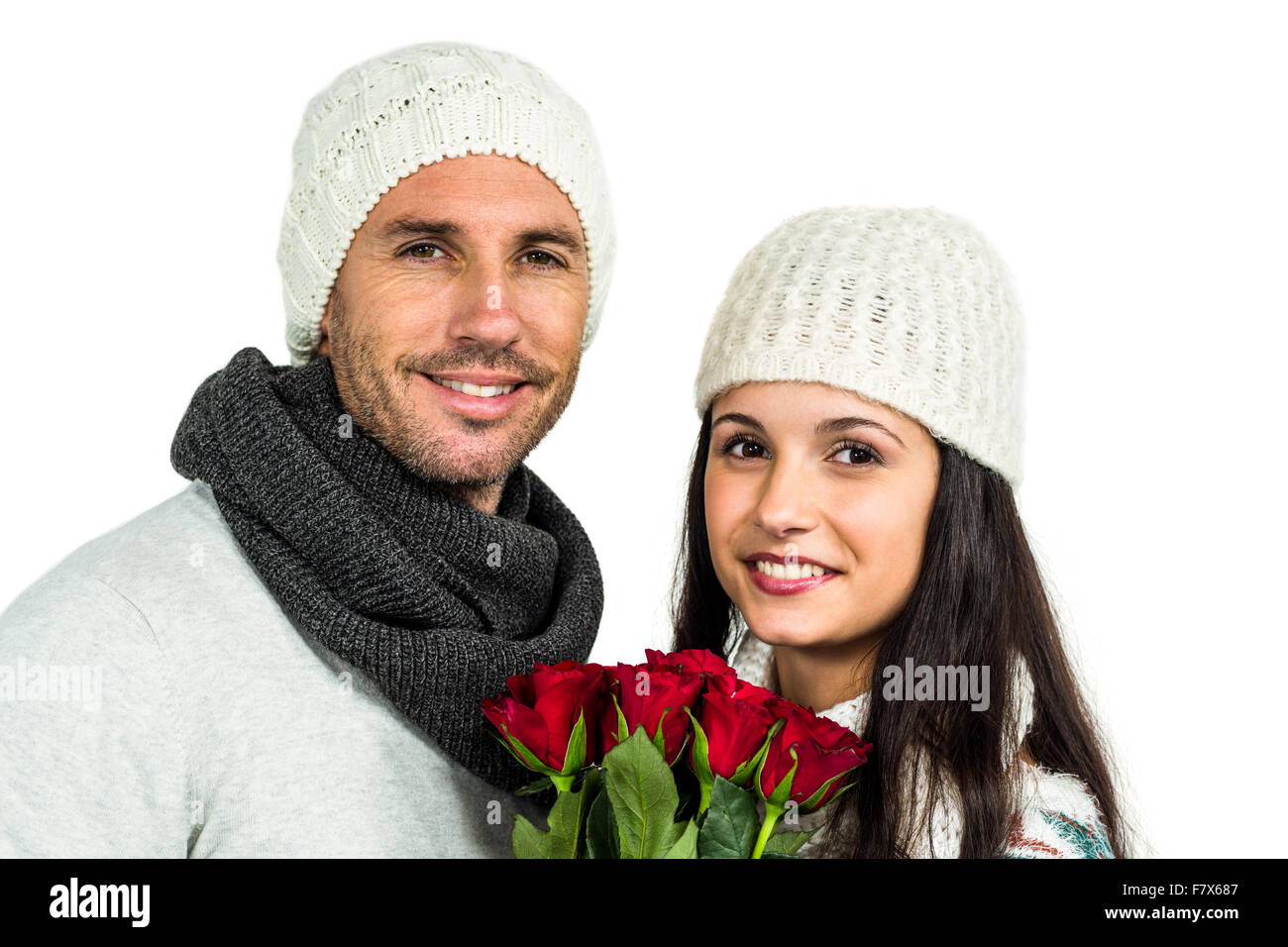 Smiling couple holding roses bouquet Stock Photo - Alamy