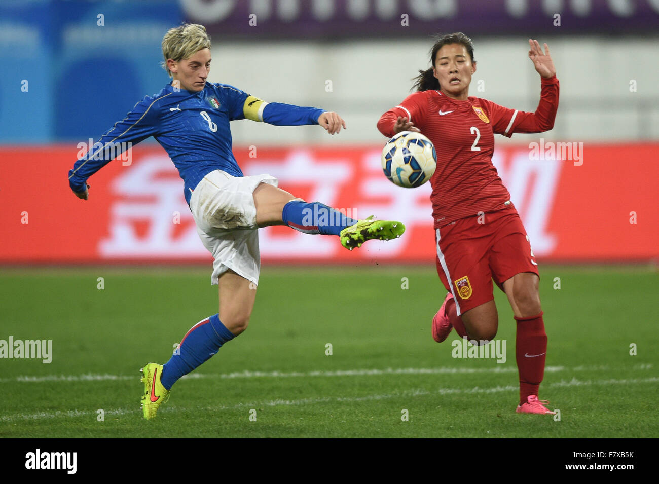 Guiyang, China's Guizhou Province. 3rd Dec, 2015. Italy's Gabbiadini Melania (L) vies with China's Liu Shanshan during their international friendly women's soccer match in Guiyang, southwest China's Guizhou Province, Dec. 3, 2015. The match ended with a 1-1 tie. © Liu Xu/Xinhua/Alamy Live News Stock Photo