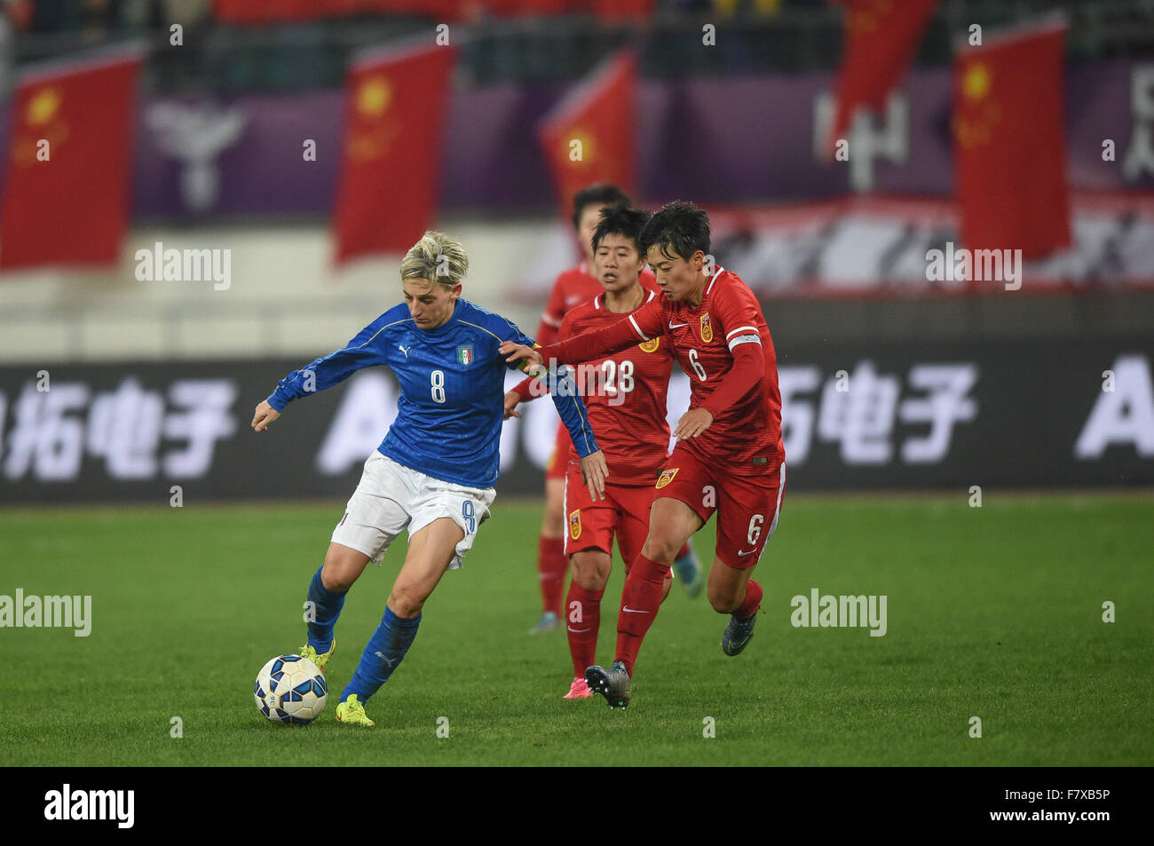 Guiyang, China's Guizhou Province. 3rd Dec, 2015. Italy's Gabbiadini Melania (1st, L) vies with China's players during their international friendly women's soccer match in Guiyang, southwest China's Guizhou Province, Dec. 3, 2015. The match ended with a 1-1 tie. © Liu Xu/Xinhua/Alamy Live News Stock Photo
