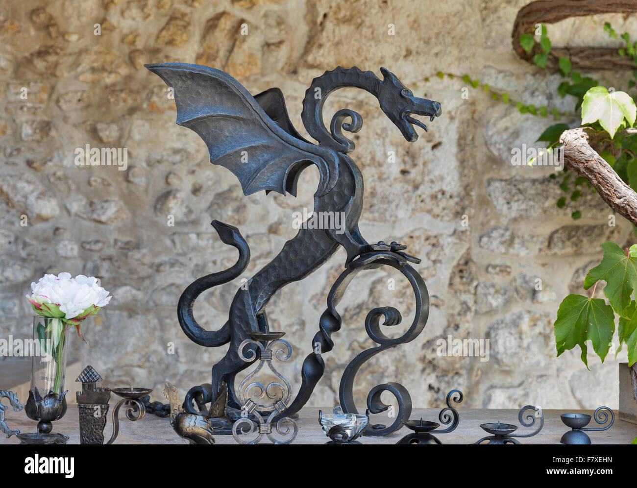 Steel gorgeous medieval mascot dragon in the form of a torch holder in Bled Castle, Slovenia. Stock Photo