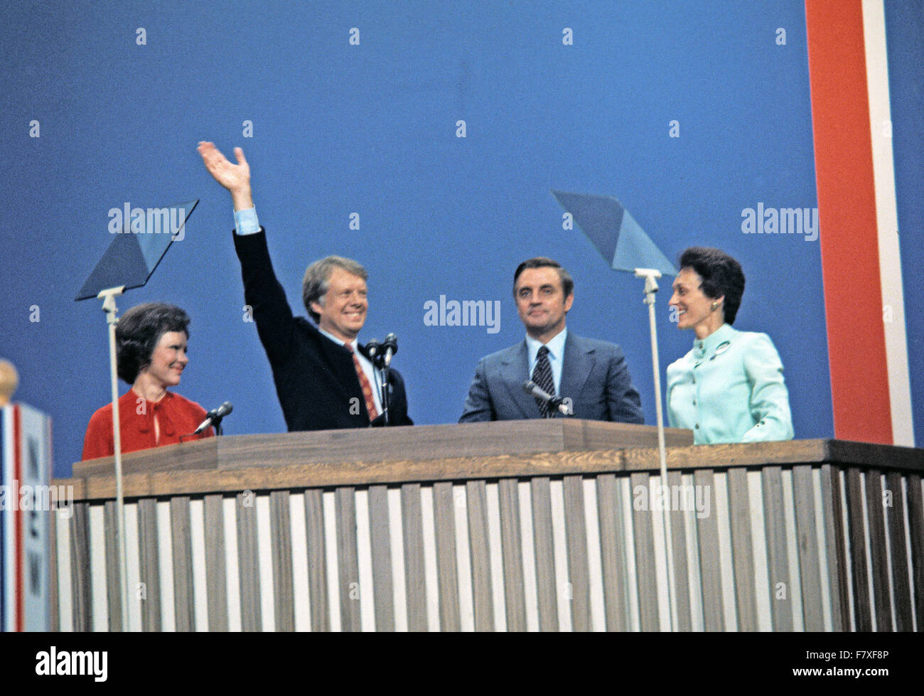 Governor Jimmy Carter (Democrat of Georgia), the 1976 Democratic Party nominee for President of the United States, left center, and US Senator Walter Mondale (Democrat of Minnesota), the 1976 Democratic Party nominee for Vice President of the US, right center, and their wives Rosalynn Carter, left, and Joan Mondale, right, acknowledge the cheers of the delegates following their acceptance speeches at the 1976 Democratic Convention at Madison Square Garden, New York, New York on July 15, 1976. Credit: Arnie Sachs/CNP - NO WIRE SERVICE - Stock Photo
