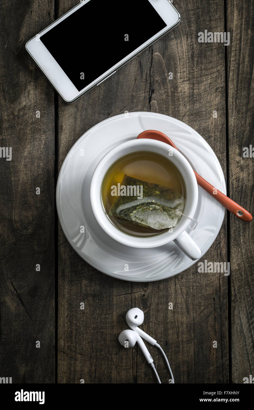 Cup of herbal tea in a wintertime composition. Stock Photo