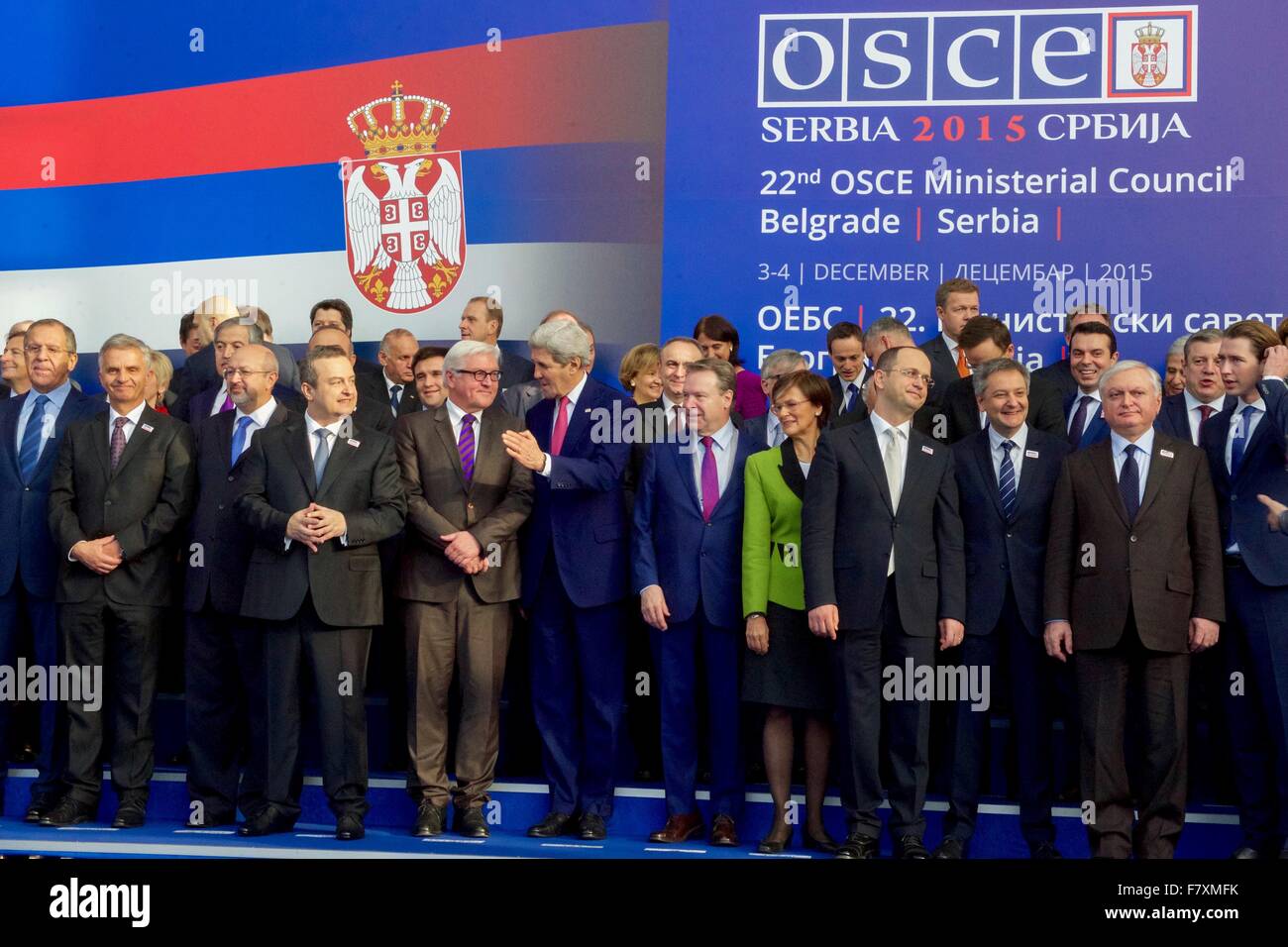 US Secretary of State John Kerry chats with German Foreign Minister Frank-Walter Steinmeier before the group photo of the 22nd OSCE Ministerial Council meeting December 3, 2015 in Belgrade, Serbia. Stock Photo