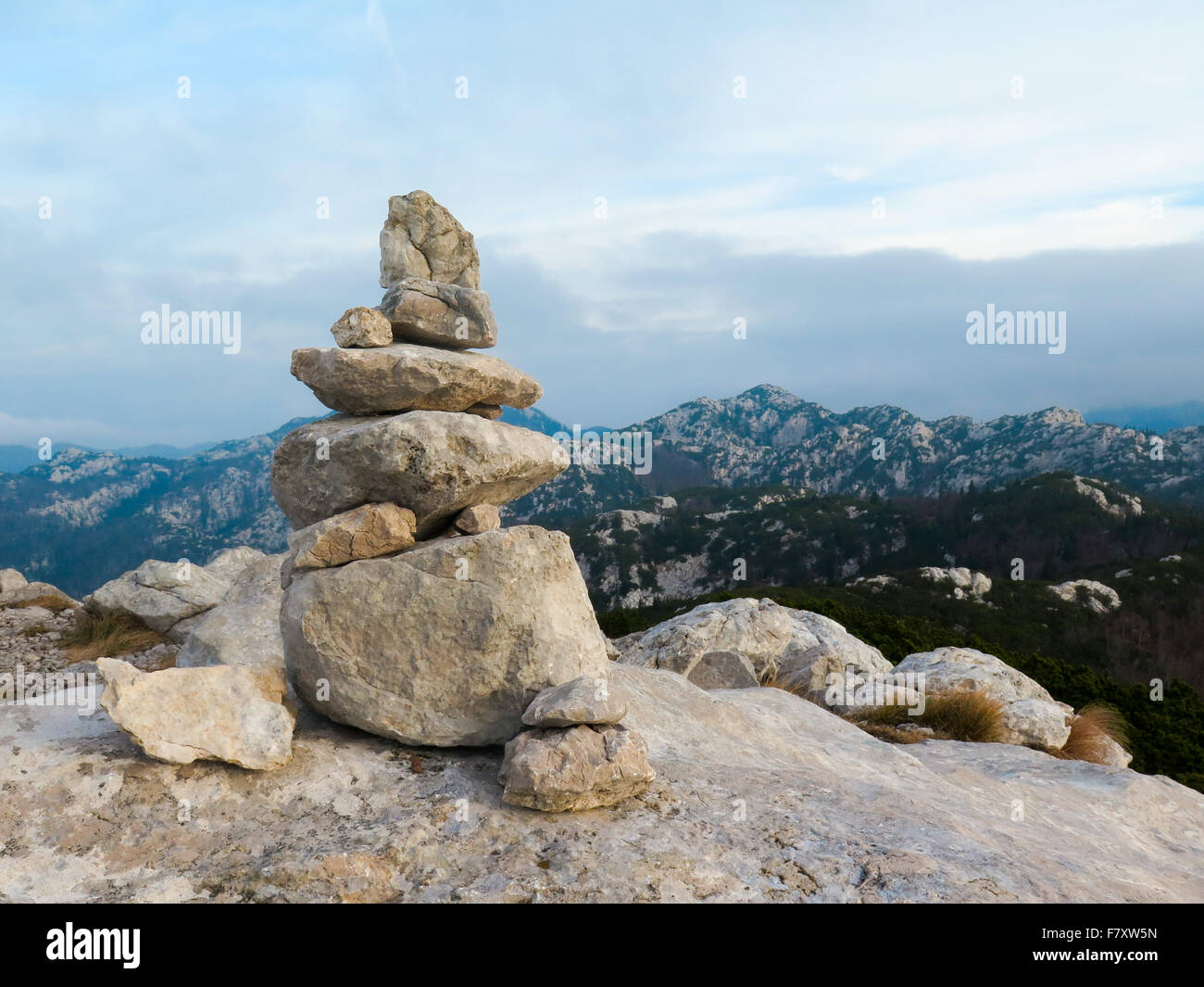 Stone pile mark on the mountain peak Stock Photo