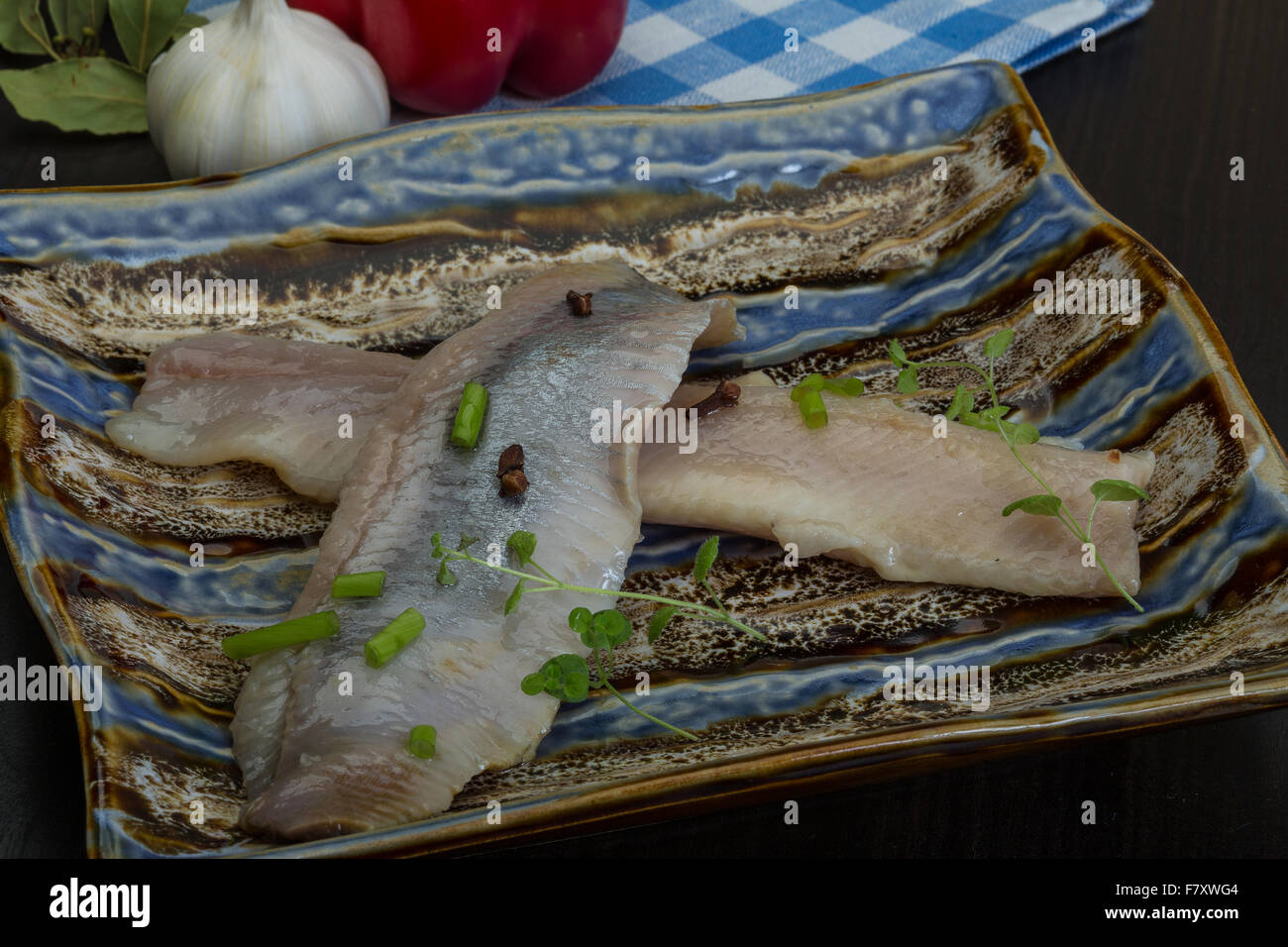 Herring fillet with herbs and spyces in the bowl Stock Photo Alamy