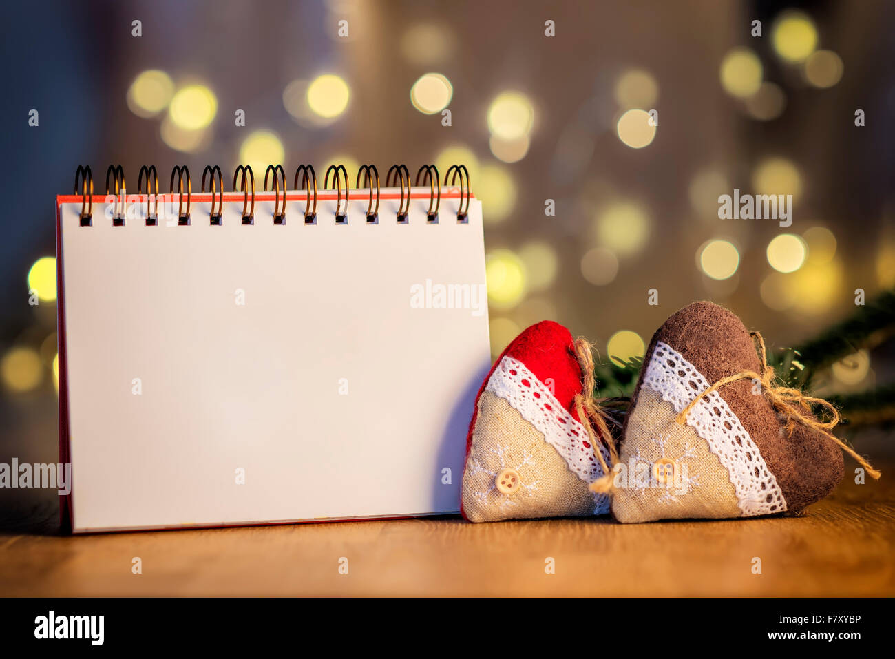 Image of empty ring binder with free space, decoration hearts and blur lights in background Stock Photo