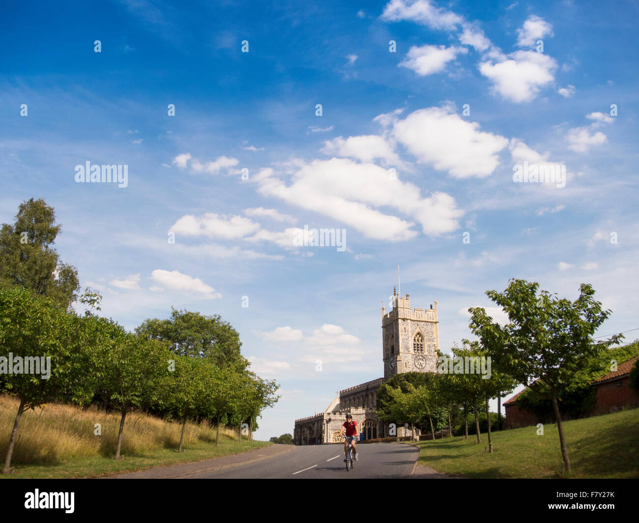 rural church with cyclist Stock Photo