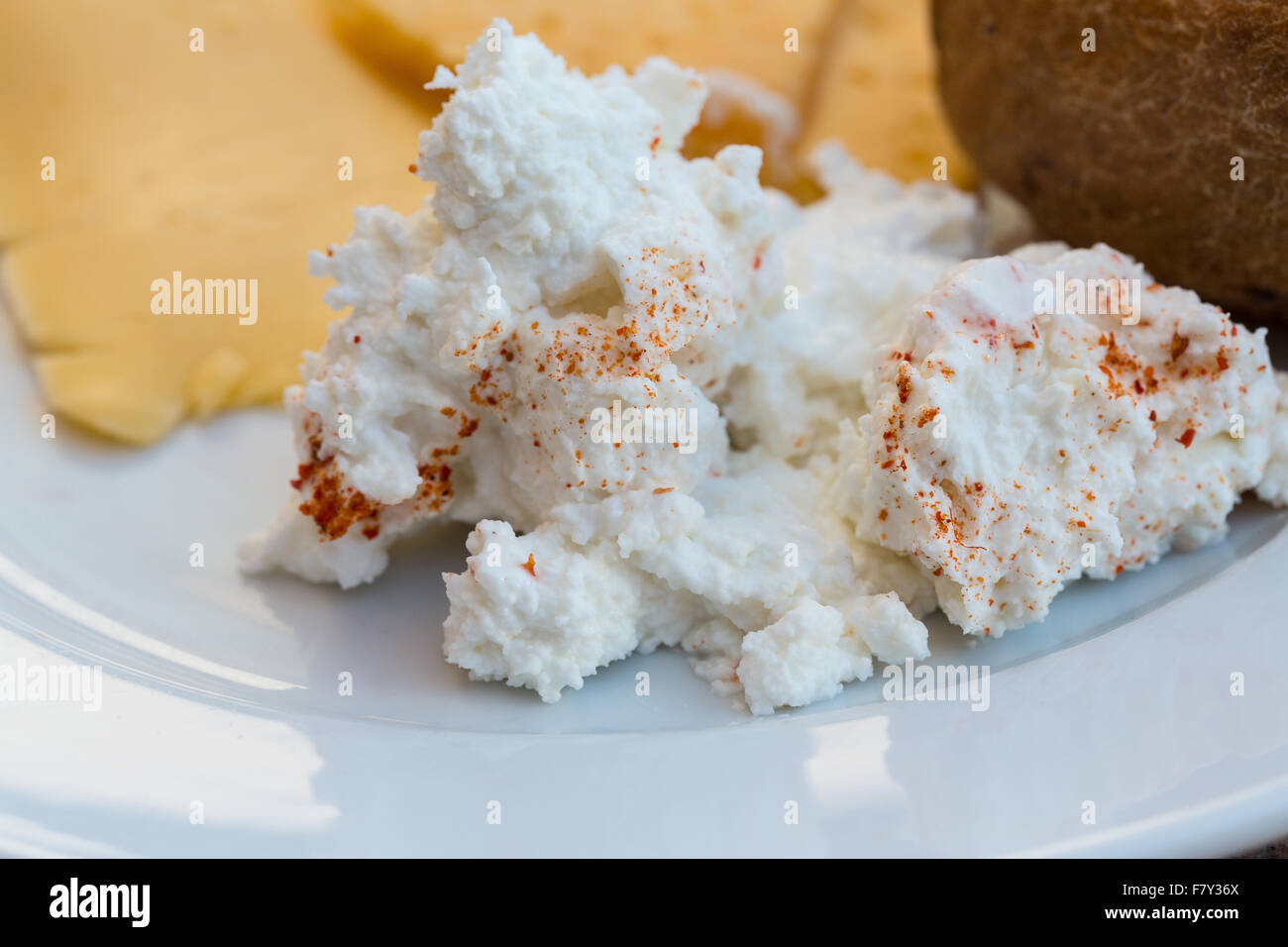 Ricotta and yellow cheeses with bun on breakfast Stock Photo Alamy