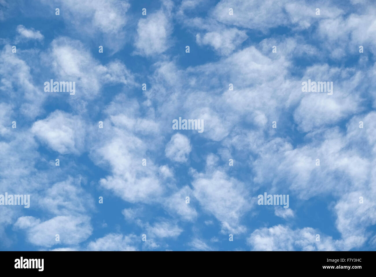 soft thin white wispy clouds against blue sky. A soft relaxing nature image. Stock Photo