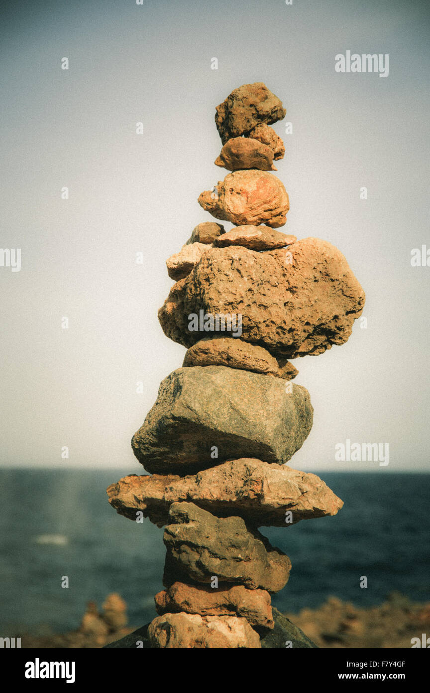 Stack of stones on sea shore, Aruba Stock Photo - Alamy