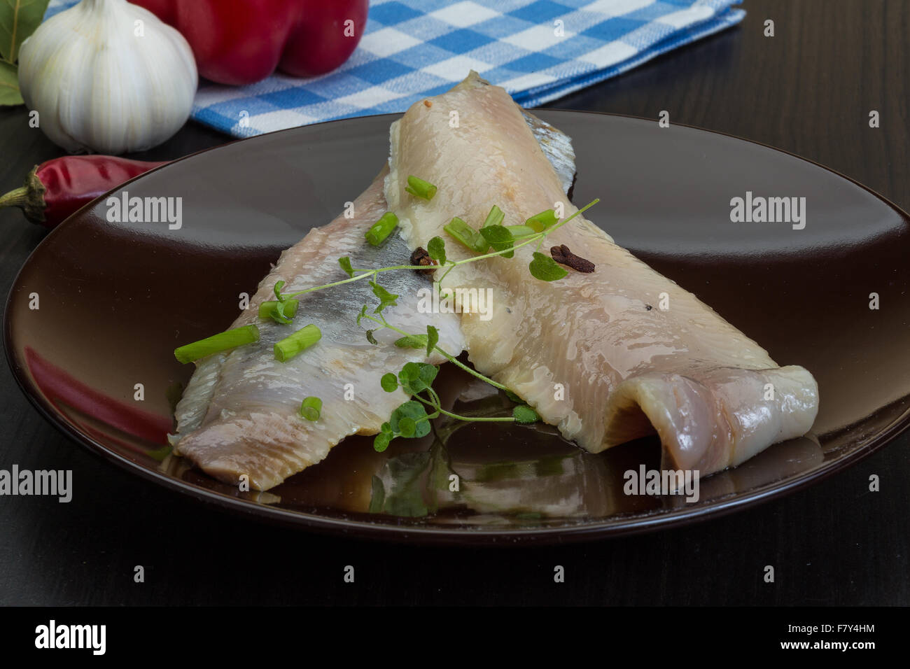 Herring fillet with herbs and spyces in the bowl Stock Photo Alamy