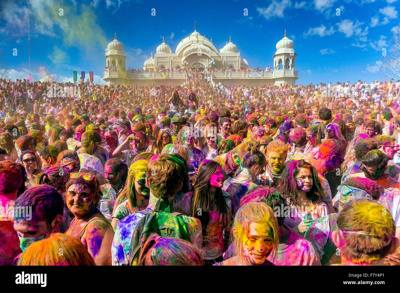 Thousands of people throw colored powder into the air during the Holi Festival of Colors at the Sri Sri Radha Krishna Temple March 30, 2013 in Spanish Fork, Utah. The festival follows the Indian tradition of Holi and attracts over 80,000 people. Stock Photo