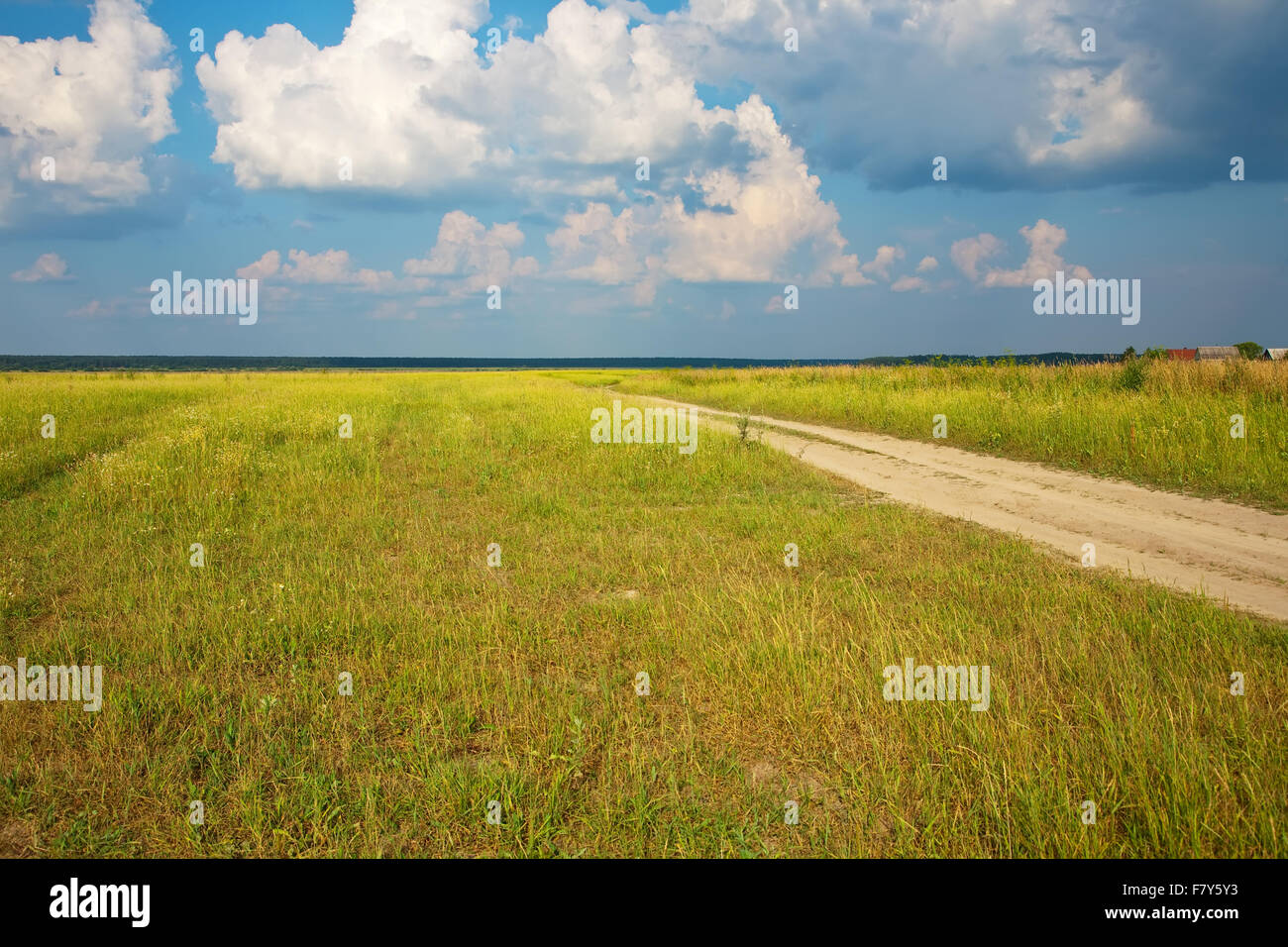 Summer landscape with road and cloudy sky Stock Photo - Alamy