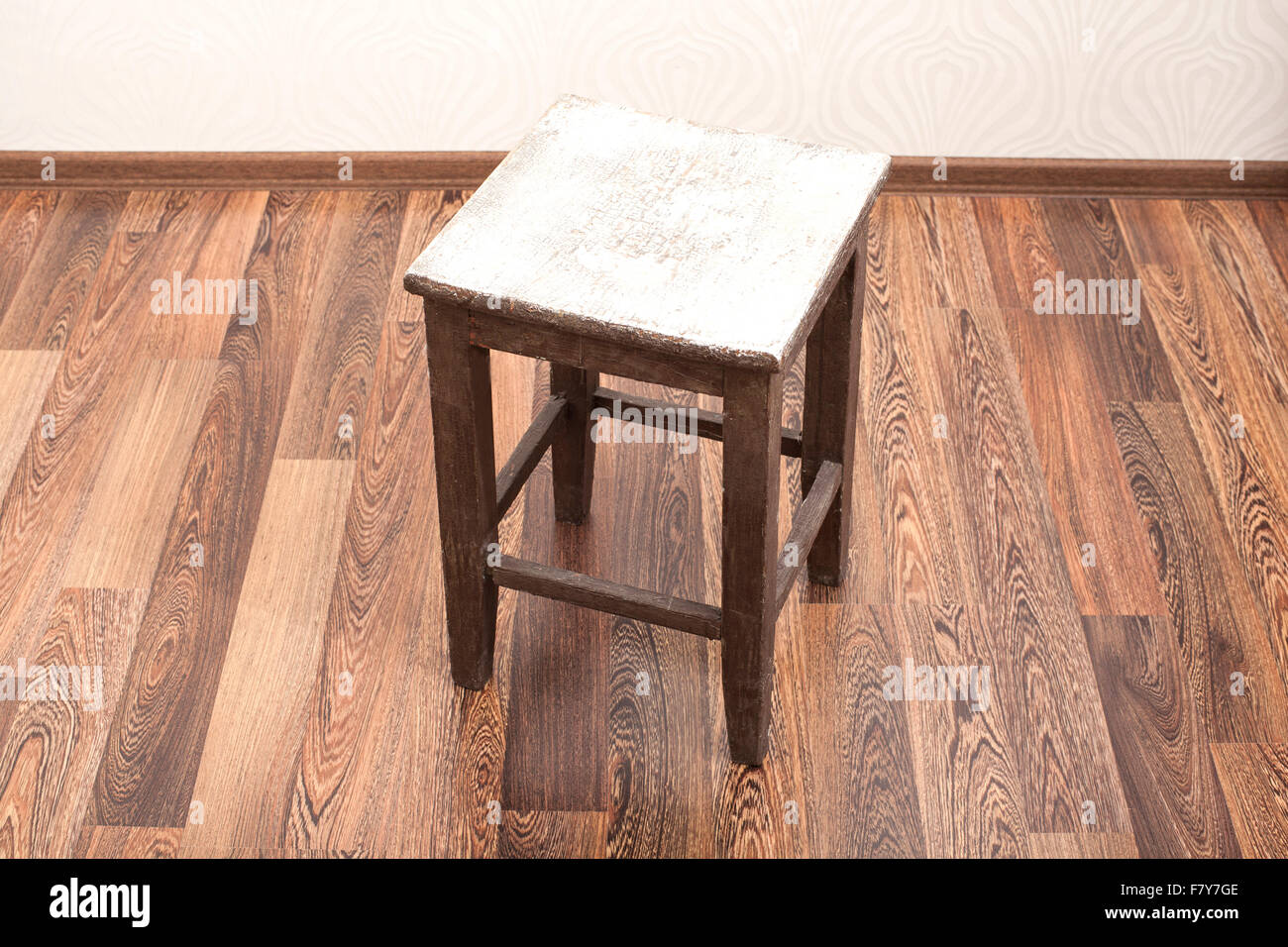 Rustic wooden stool in room Stock Photo - Alamy