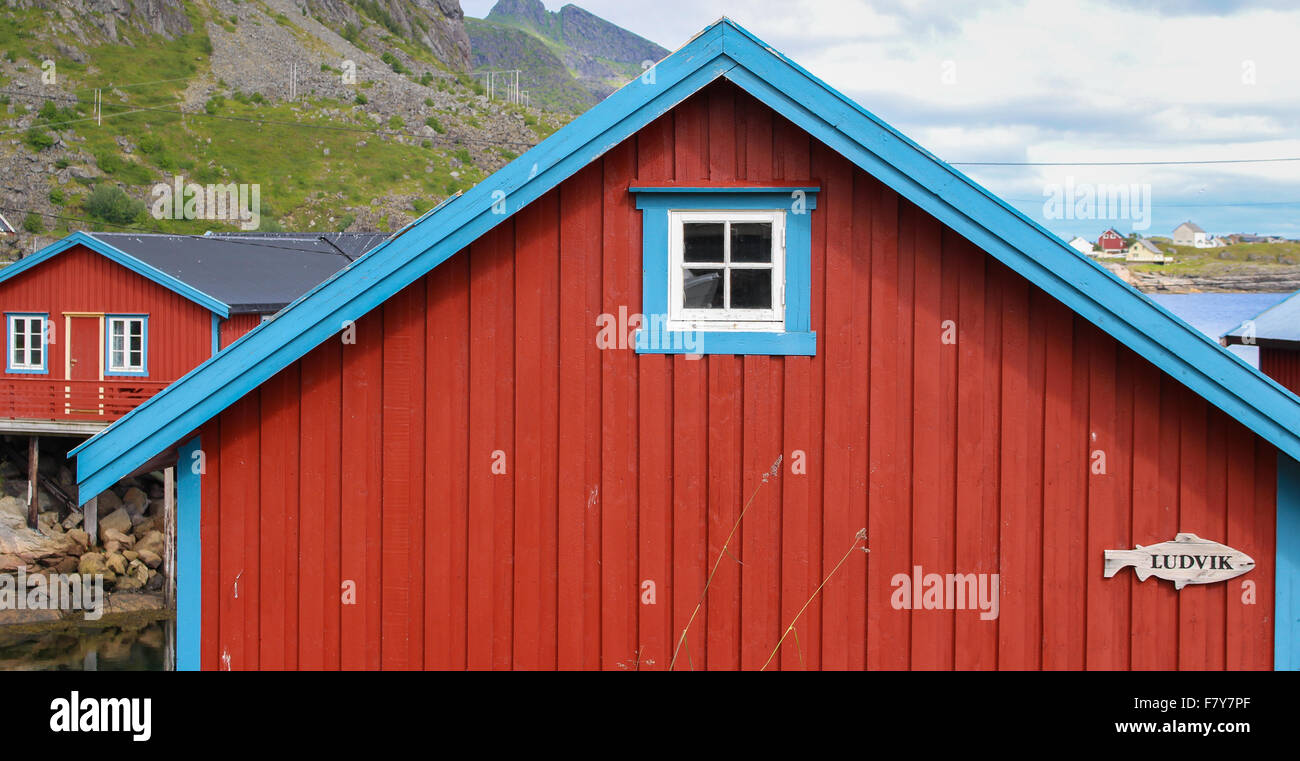 Painted wooden fisherman's cabins or rorbuer in the little port village of ' A ' in the Lofoten Islands of Norway Stock Photo