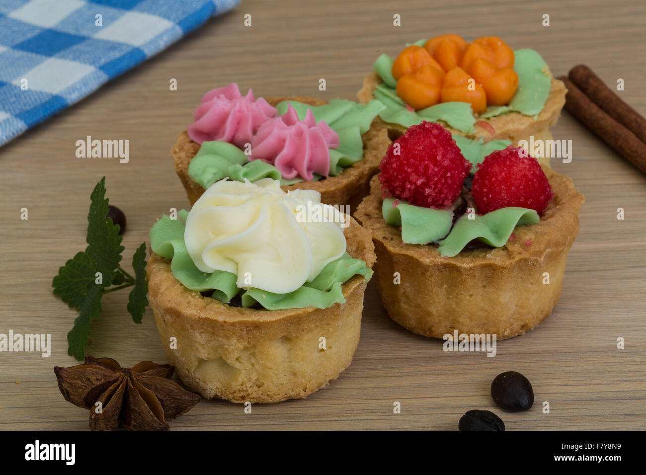 Mini jam cakes with cream in the basket Stock Photo Alamy