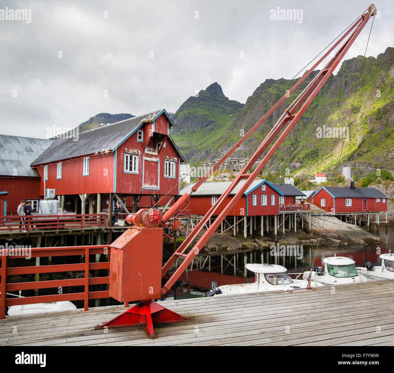 Jetty and harbour buildings in the small fishing village of A in the western Lofoten Islands with small quayside winch Stock Photo