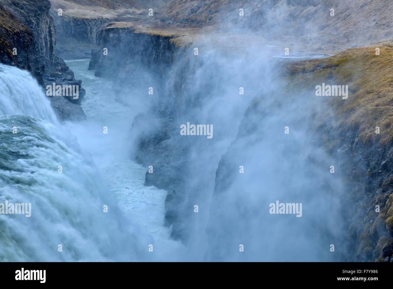 Gullfoss Waterfall, spray in strong wind, Iceland Stock Photo