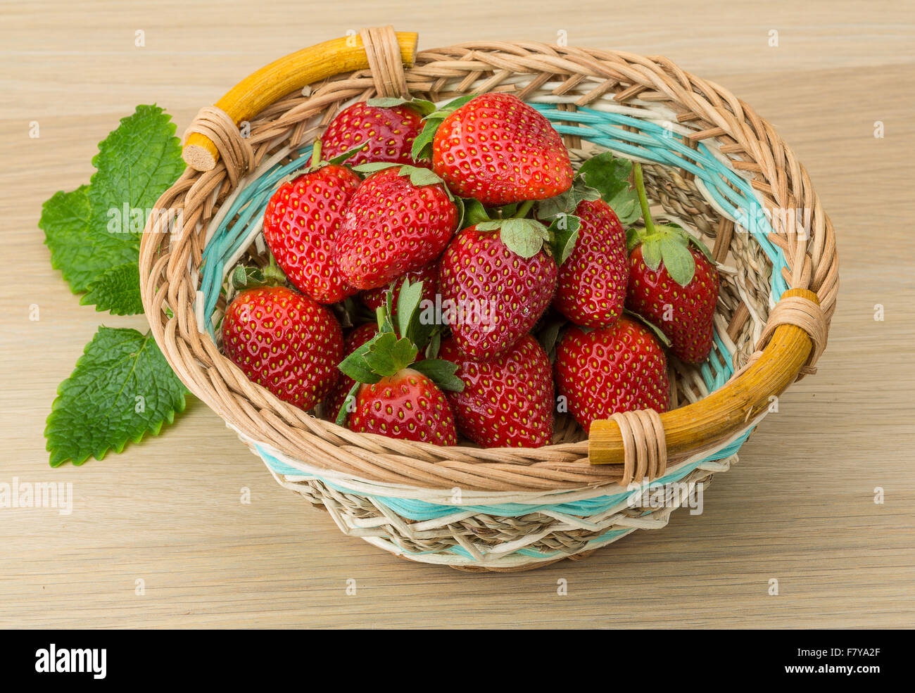 Fresh ripe strawberries in the bowl on wooden background Stock Photo ...