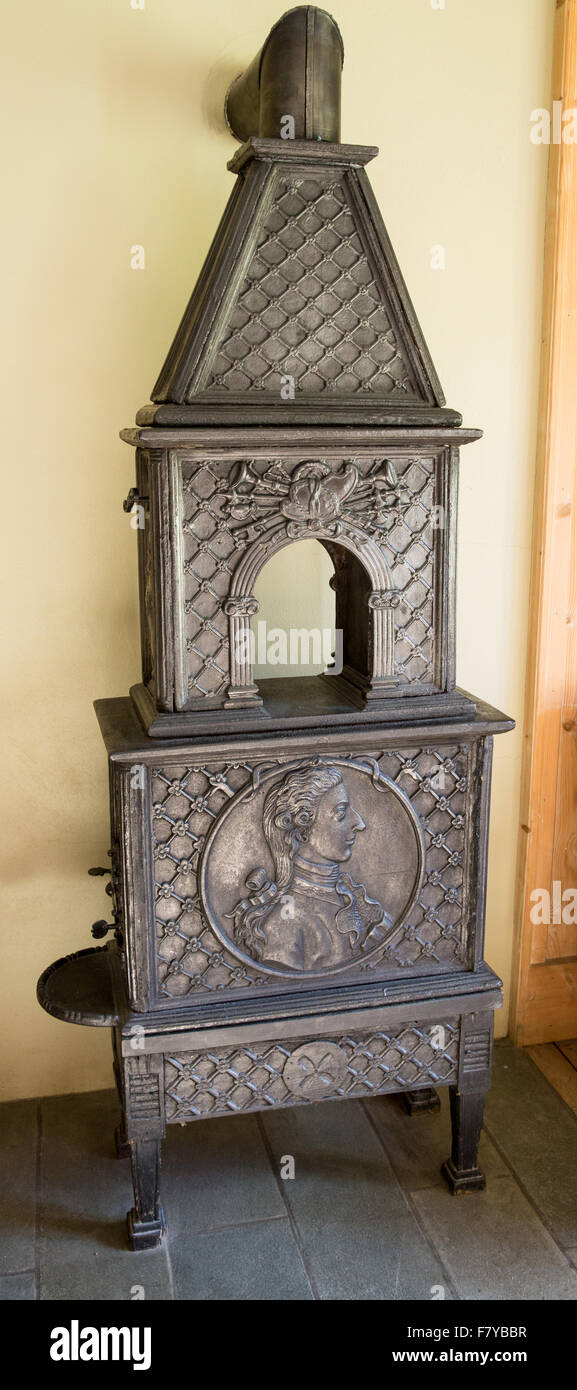 Elegant antique cast iron wood burning stove at the Kongsvold Hotel in Oppland central Norway Stock Photo