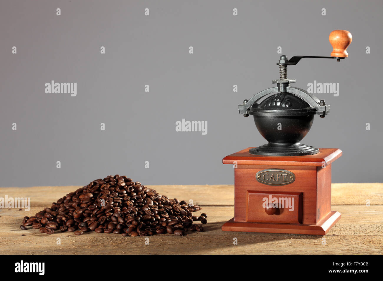 Manual coffee grinder, coffee beans on table Stock Photo Alamy