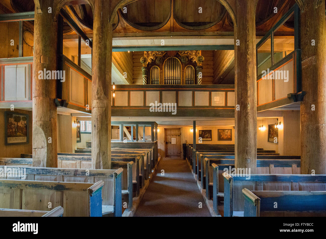 Interior of Lom stave church in Oppland central Norway showing the free standing wooden staves supporting the roof Stock Photo