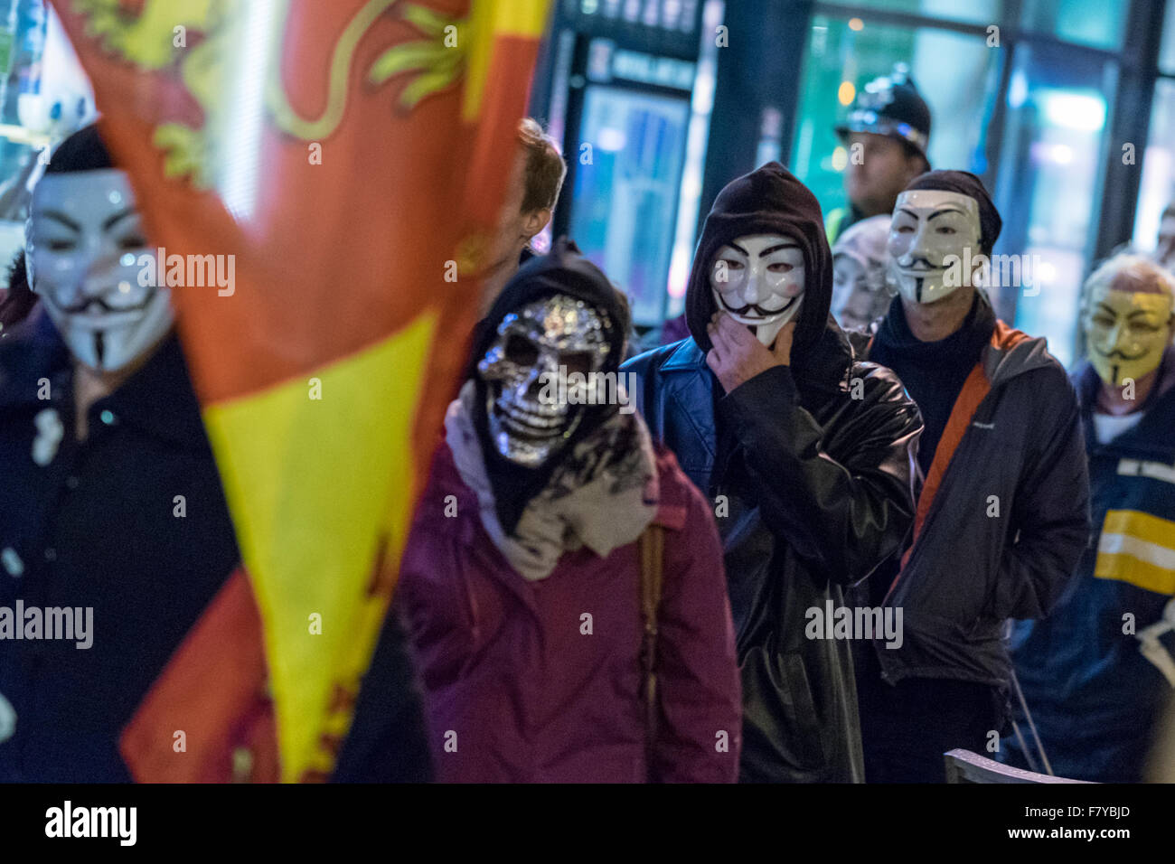 City Centre, Cardiff, Wales, UK, November 5, 2015: Anonymous activists gathers in front of Aneurin Bevan statue. Stock Photo