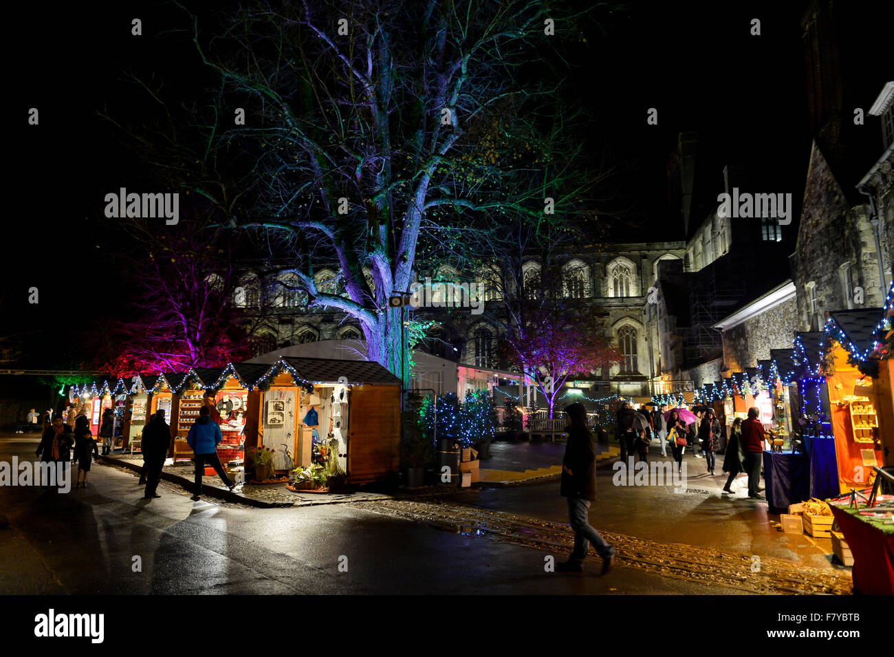 Winchester Christmas Market, Hampshire UK. Stalls of the annual Christmas market light up the