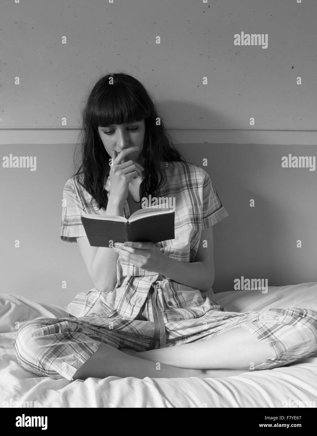 Pretty Russian student reading in bed. June 214 Stock Photo Alamy