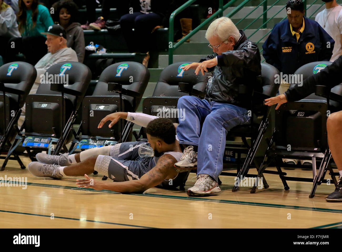 December 2, 2015: New Orleans Privateers guard Christavious Gill (5) falls into a fan courtside during the game between Tulane and the University of New Orleans at Fogelman Arena in Devlin Fieldhouse, New Orleans Louisiana © Steve Dalmado/Cal Sport Media Stock Photo