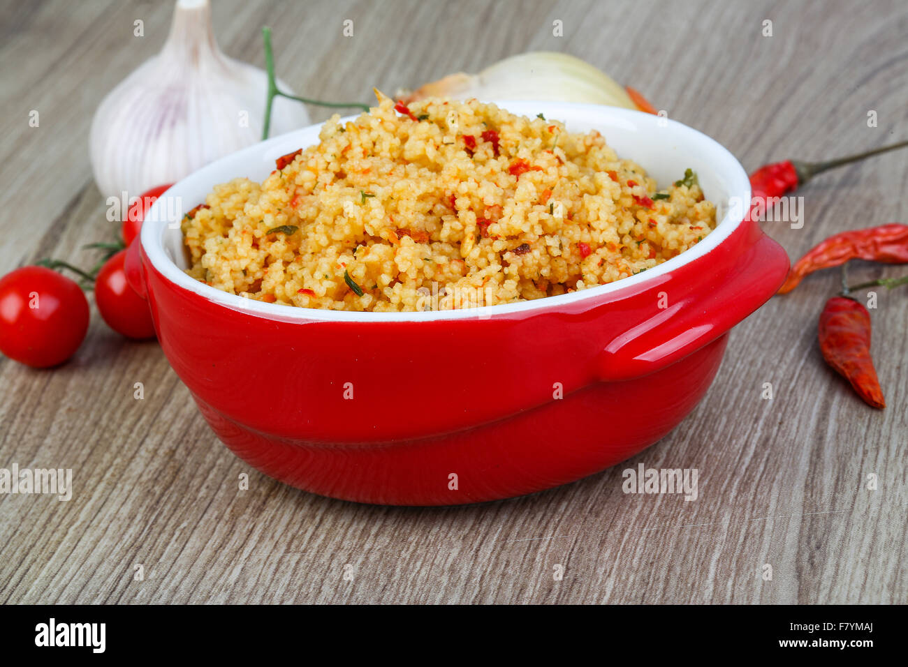 Arabic traditional cuisine Couscous with tomato and green onion Stock