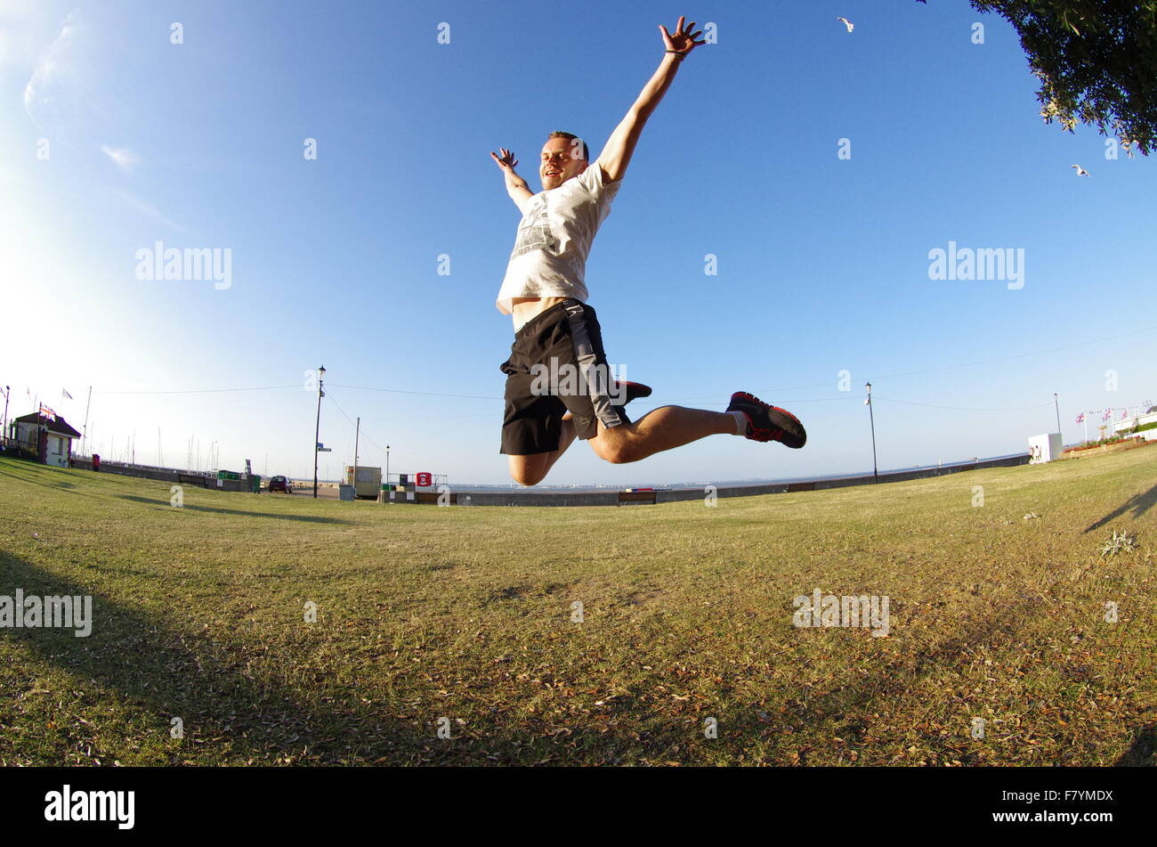 Boy jumping high in air hi-res stock photography and images - Alamy