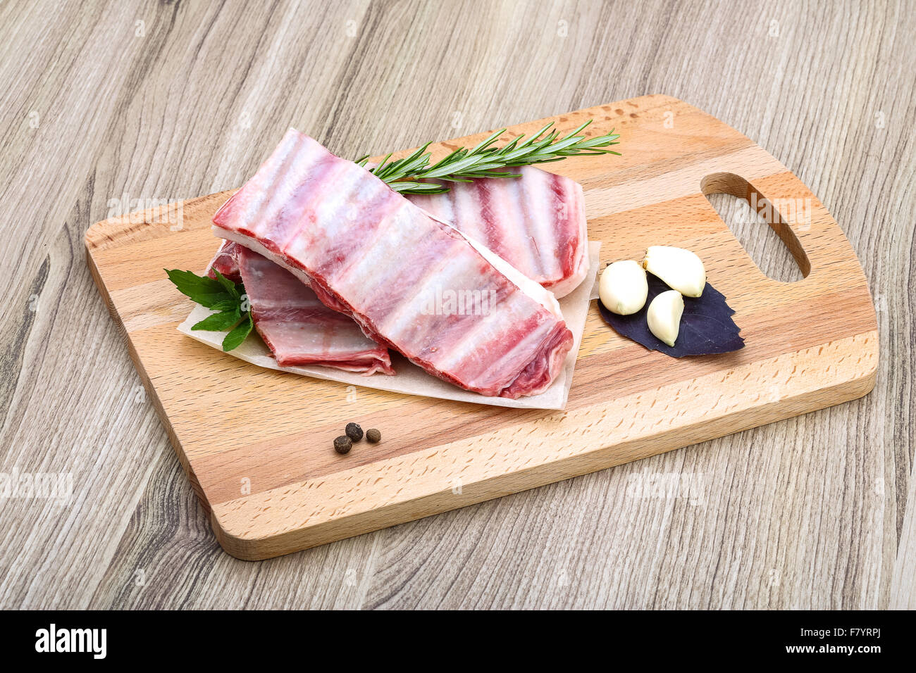 Fresh cold Raw lamb ribs with garlik and pepper - ready for cooking ...
