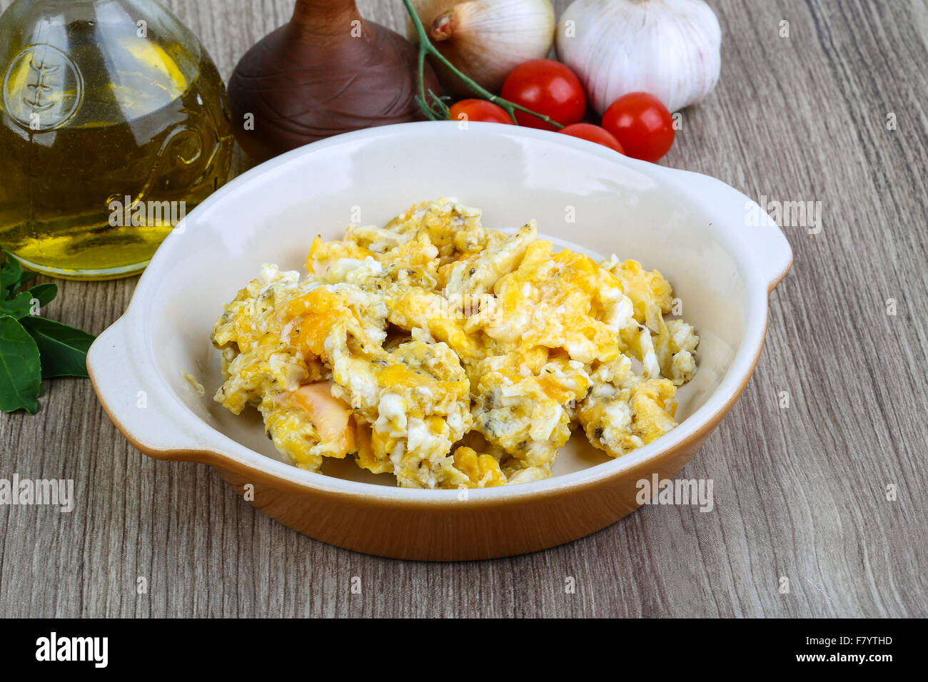 Scrambled eggs for breakfast on the wood background Stock Photo - Alamy