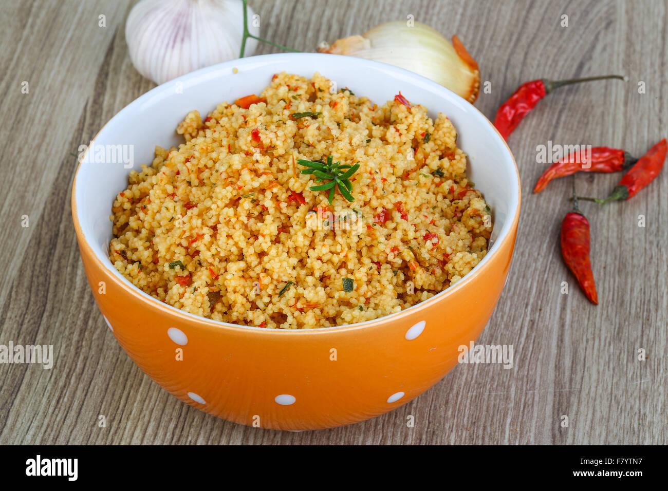 Arabic traditional cuisine Couscous with tomato and green onion Stock