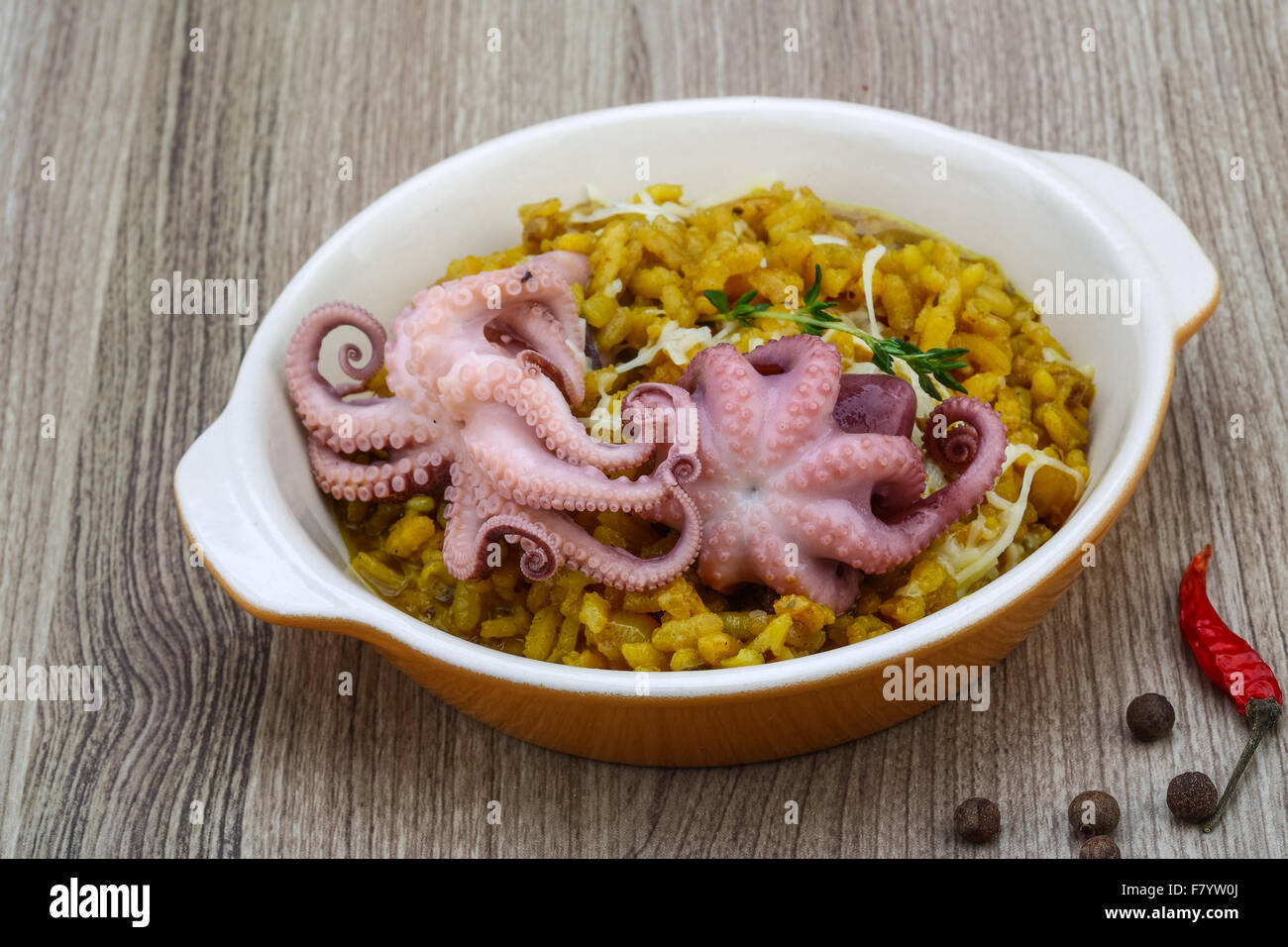 Seafood risotto with octopus, cheese and thyme leaf Stock Photo - Alamy