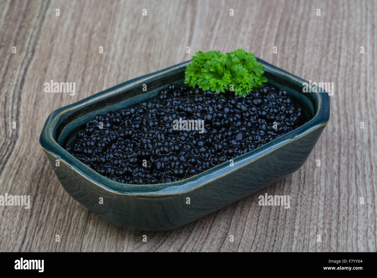 Luxury Black caviar in the bowl with parsley leaves Stock Photo Alamy