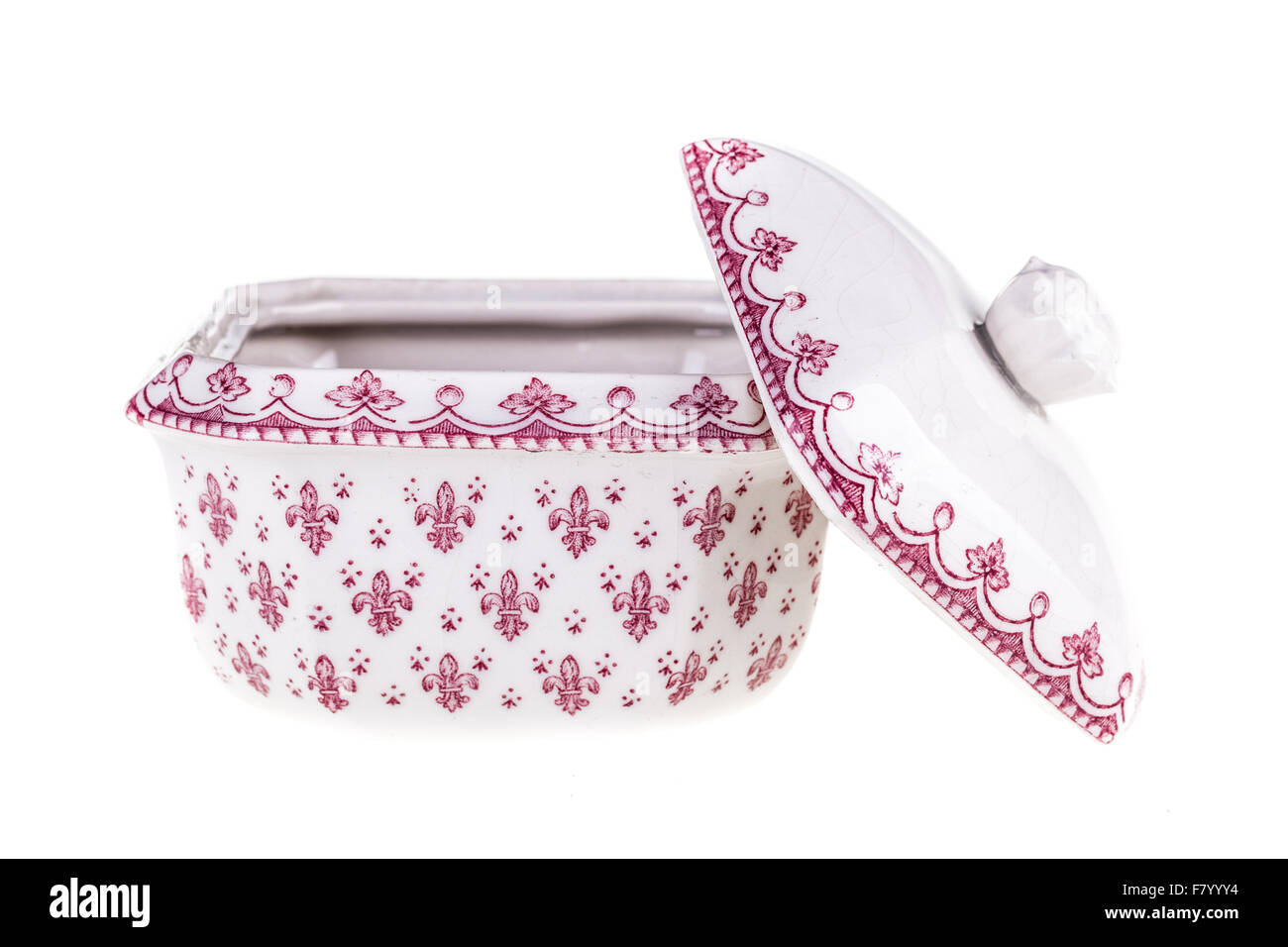 a decorated white porcelain sugar bowl isolated over a white background Stock Photo