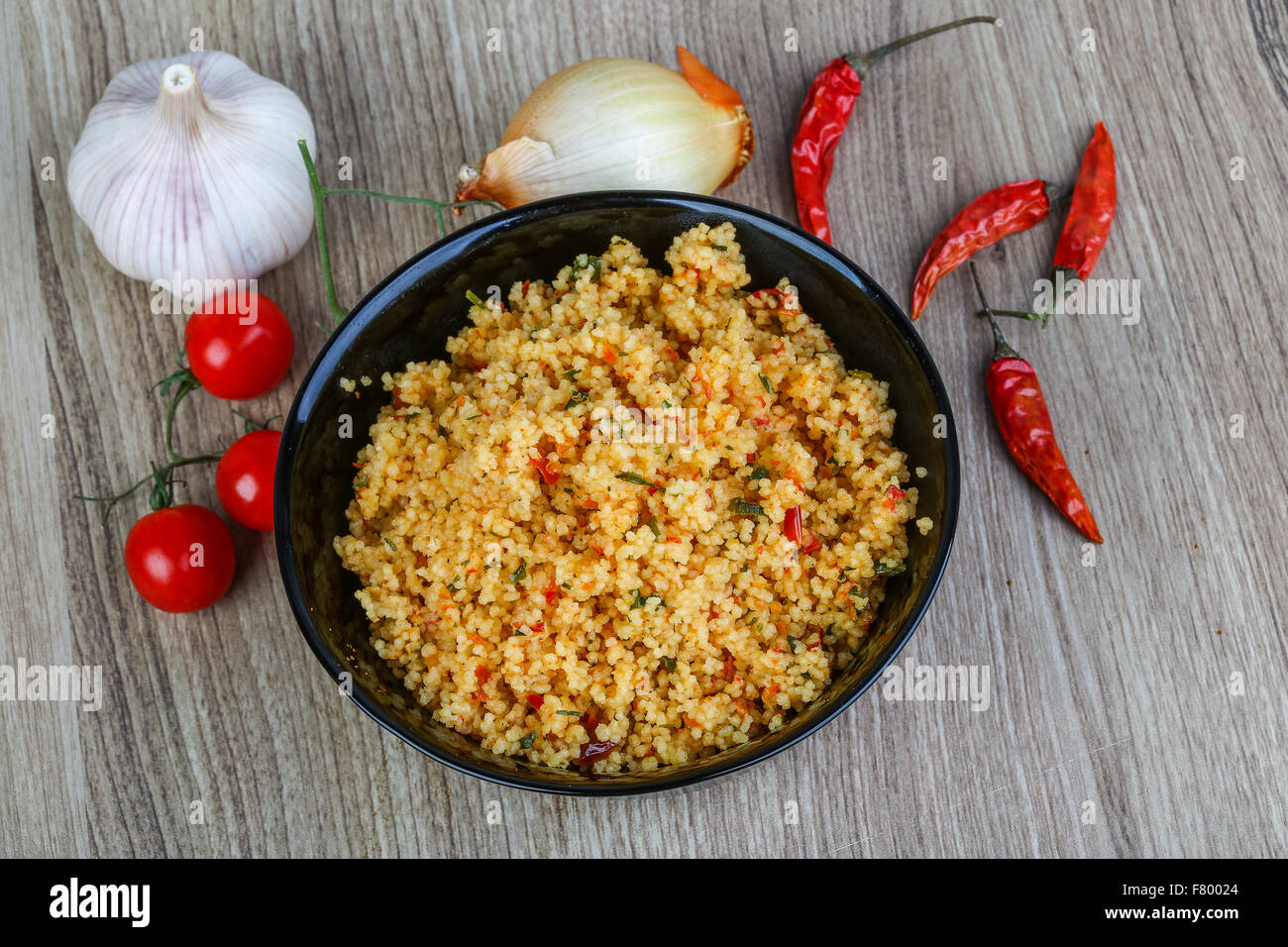 Arabic traditional cuisine Couscous with tomato and green onion Stock
